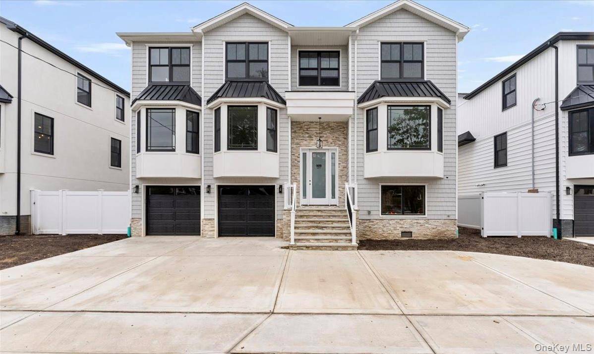 Welcome to 909 Greenfield Rd, a stunning new construction in the prestigious Academy Area of Woodmere.