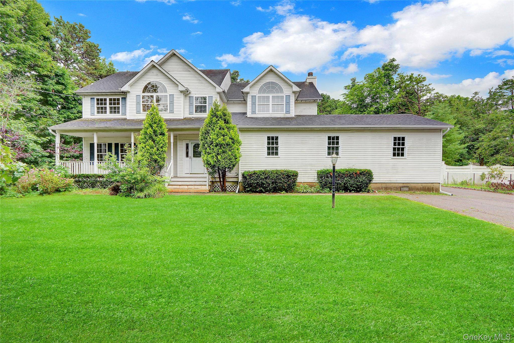 Extra Large, newer colonial style home with full basement, 2 Car Detached garage, accessory area, having hardwood flooring, Eat In Kitchen, Den with fireplace, spacious rooms, and grand appearance.