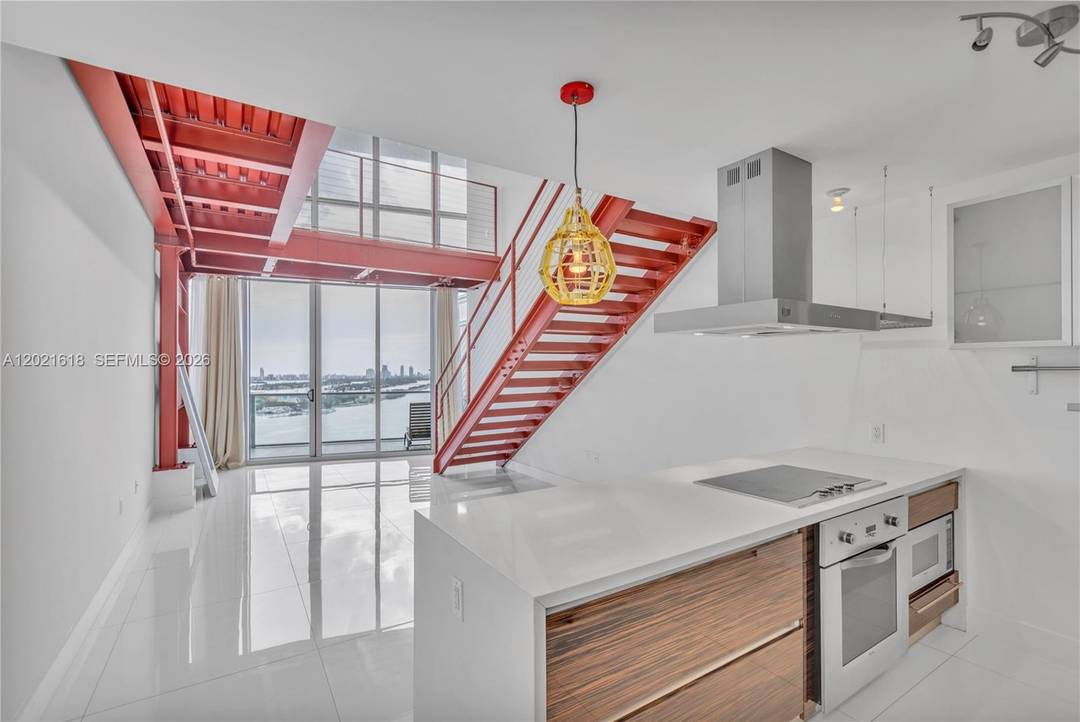 Experience breathtaking oceanfront views from this one of a kind loft residence at Marquis Condo in the heart of Miami.