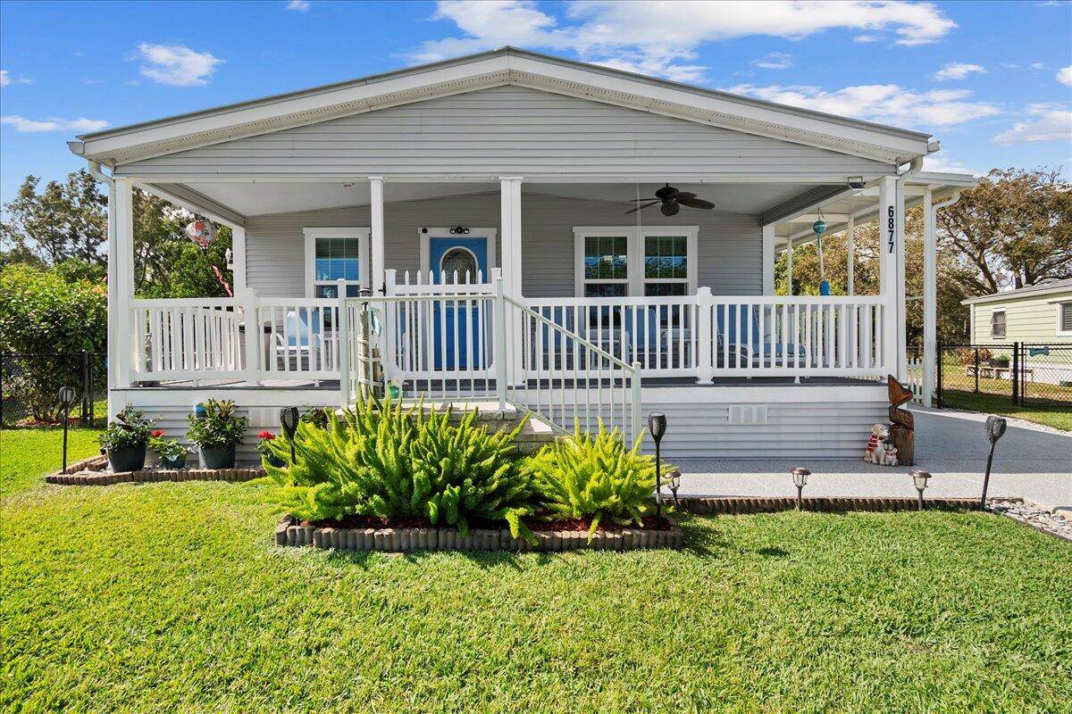 Paradise in Hobe Sound ! Only section of 55 Cambridge at HRS that allows RVs boats, this stunning Key West style home has been lovingly cared for with many features.