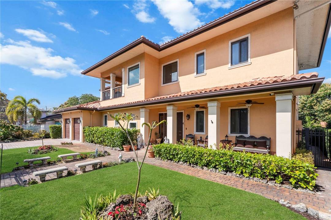 Cuban inspired custom residence built in 2017, featuring authentic Cuban tile floors and designed with a focus on enduring quality, architectural scale, and craftsmanship.