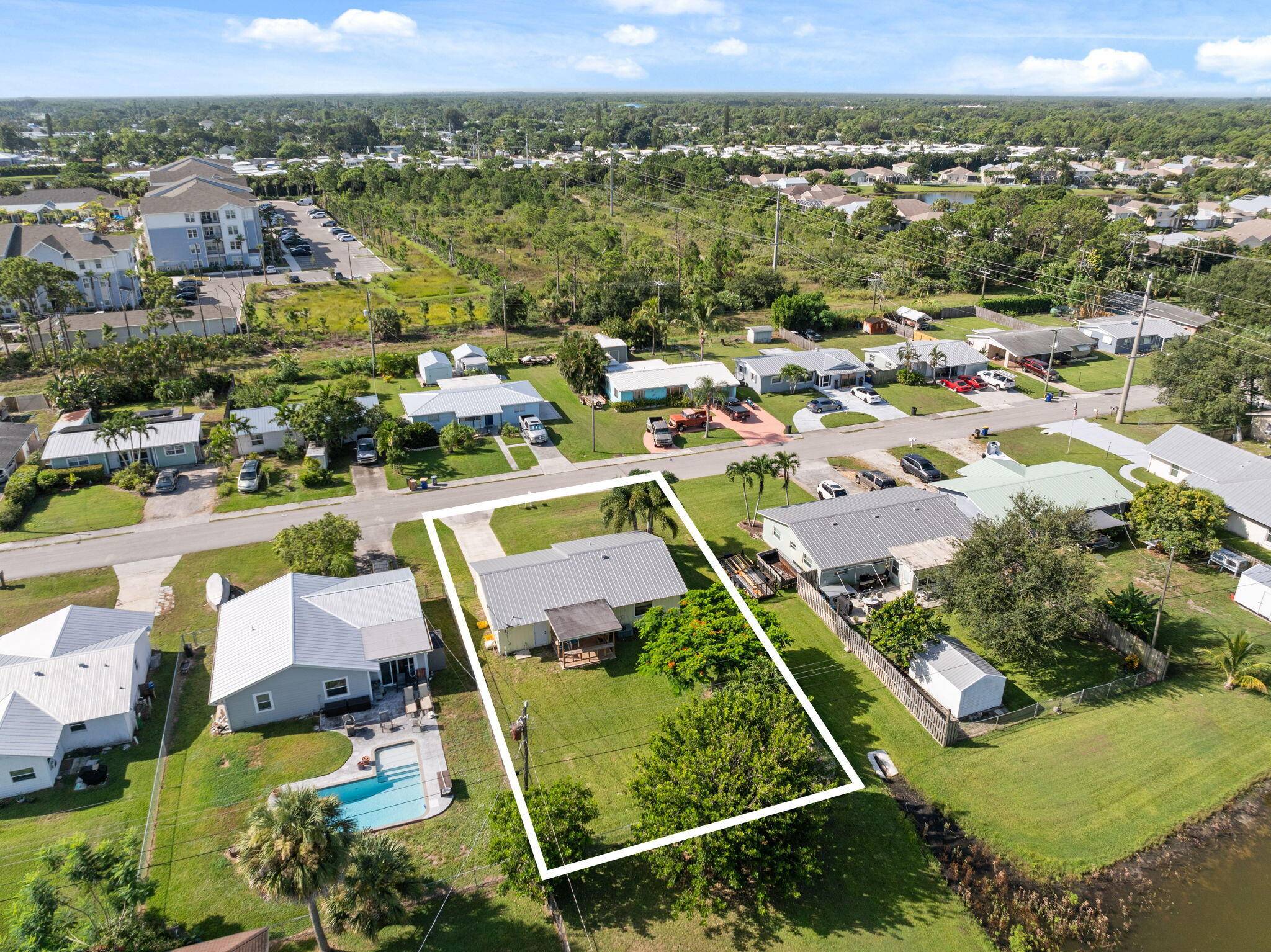 Positioned on a corner lake view lot, this residence presents a unique opportunity in the heart of Stuart.