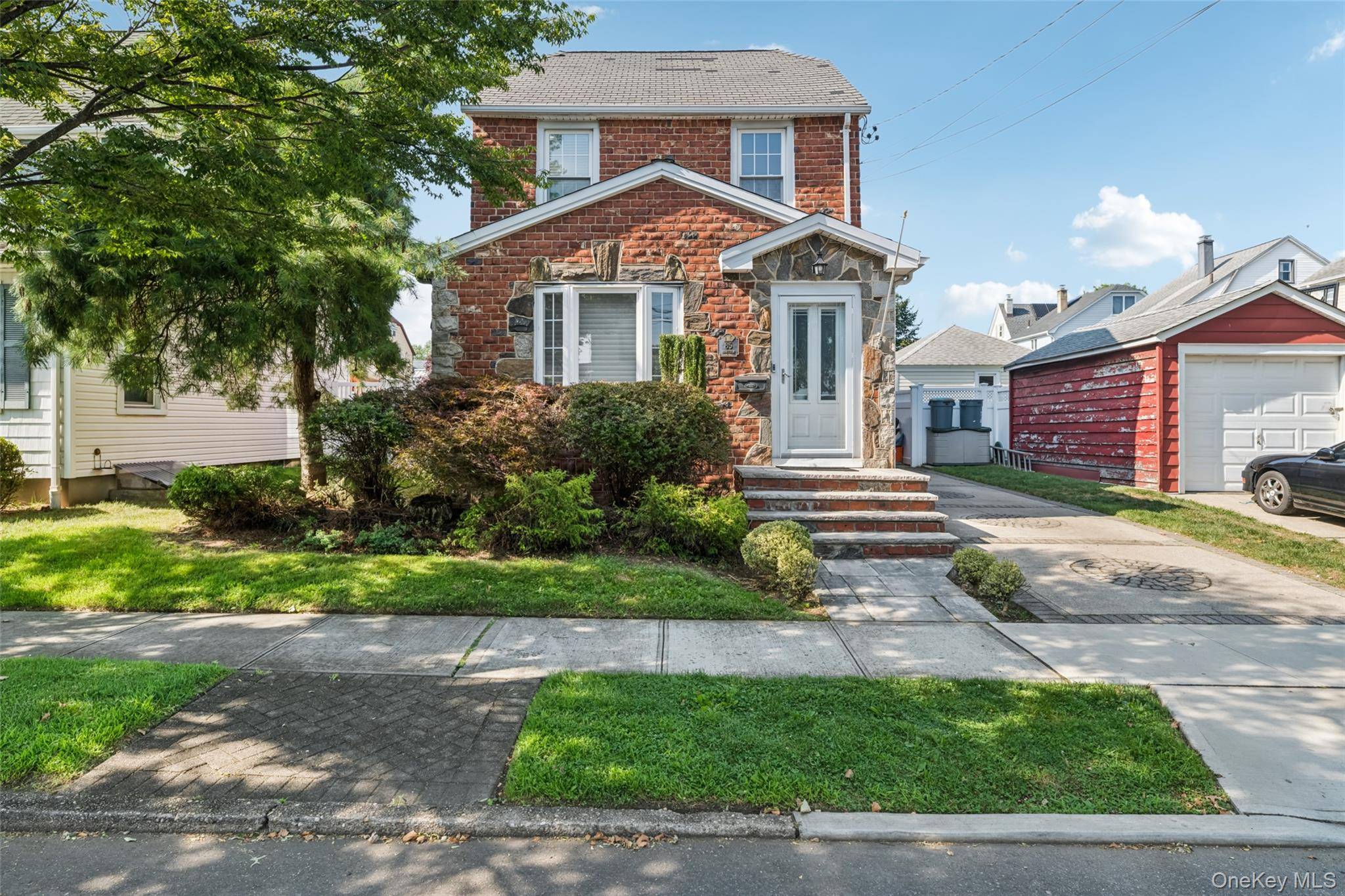 Classic charm meets modern space in this expanded 4 bedroom brick Colonial with hardwood floors and sun filled primary suite, offering approx.