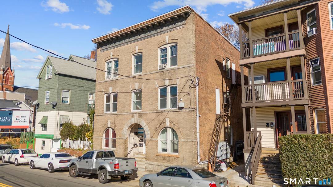 OPEN TO PACKAGE DEAL WITH 25 37 PIEDMONT ST 815 E Main presents a rare opportunity to acquire a beautifully renovated 10 unit stone building in the heart of downtown ...