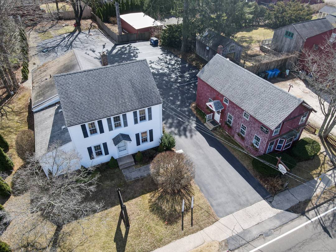 RARE OPPORTUNITY TO OWN TWO BUILDINGS IN GUILFORD Unlock the potential of this prime commercial property on the bustling Boston Post Road, just one block from Guilford's historic town Green.