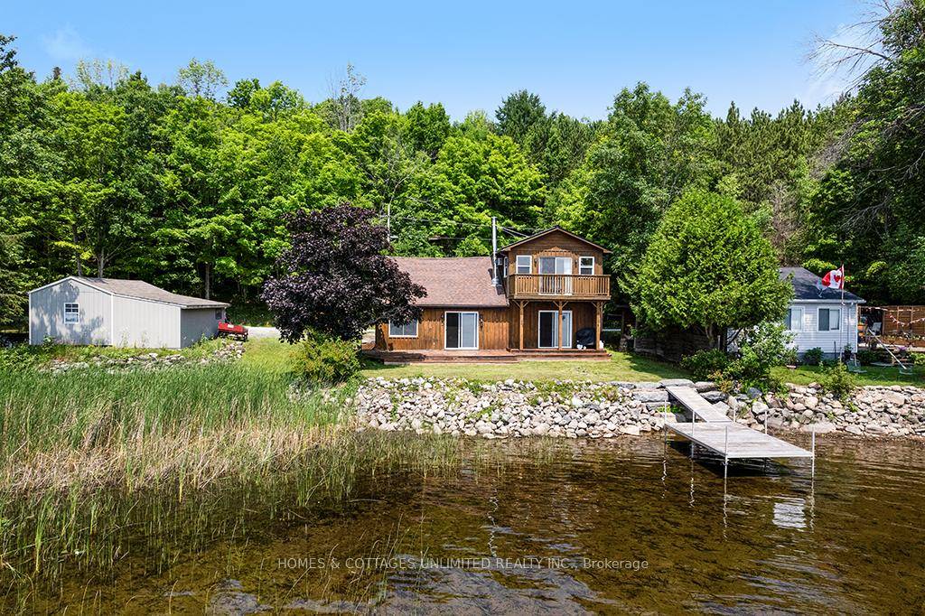 Nestled on the tranquil north shore of Dalhousie Lake, this well maintained, partially furnished home or cottage is move in ready just in time for summer memories.