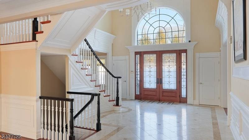 Welcome to this exceptional custom built brick Colonial, where timeless architecture meets refined craftsmanship.