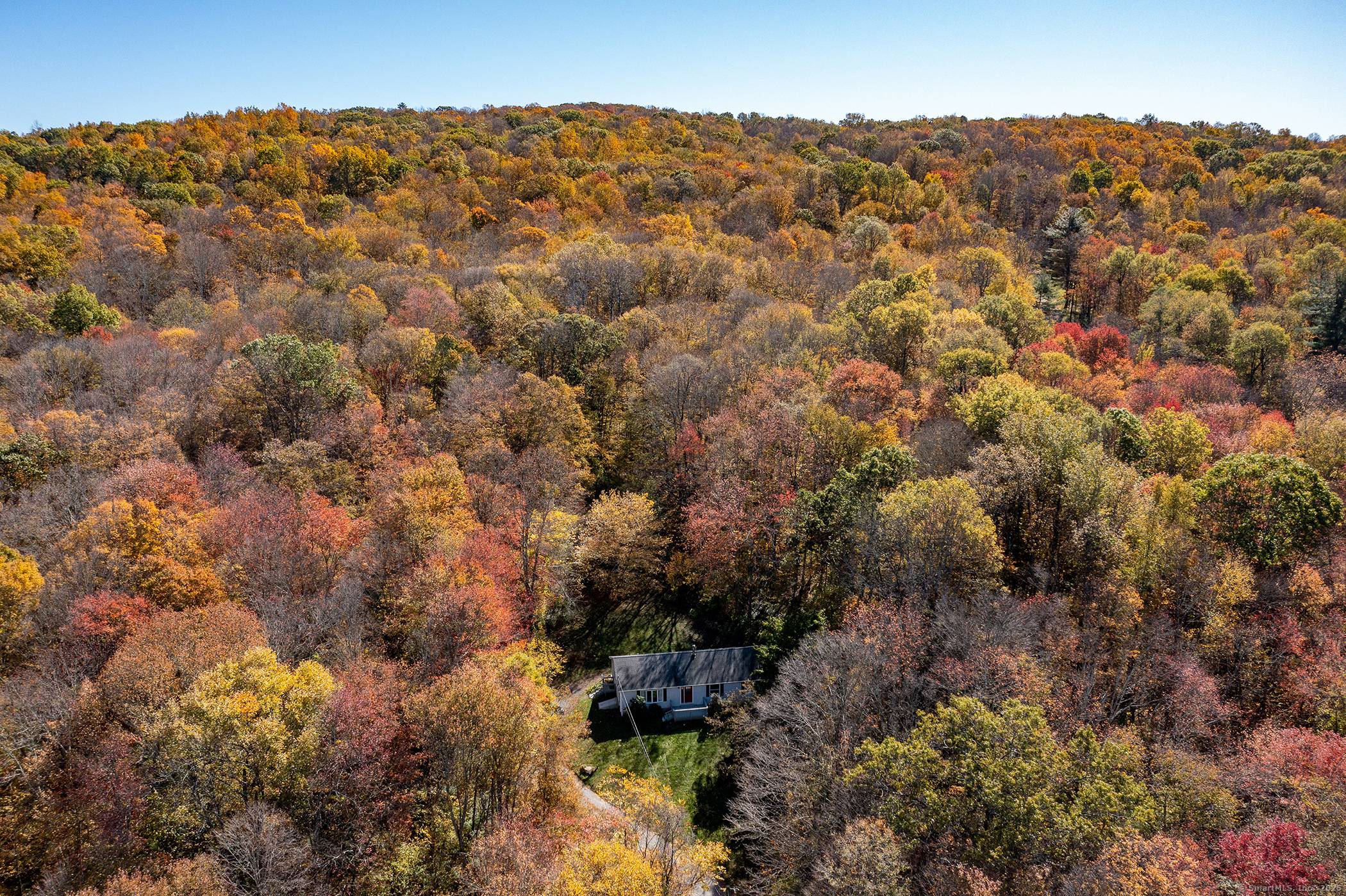 Exceptional 25 acres across two parcels in New Preston with town beach rights to Lake Waramaug.