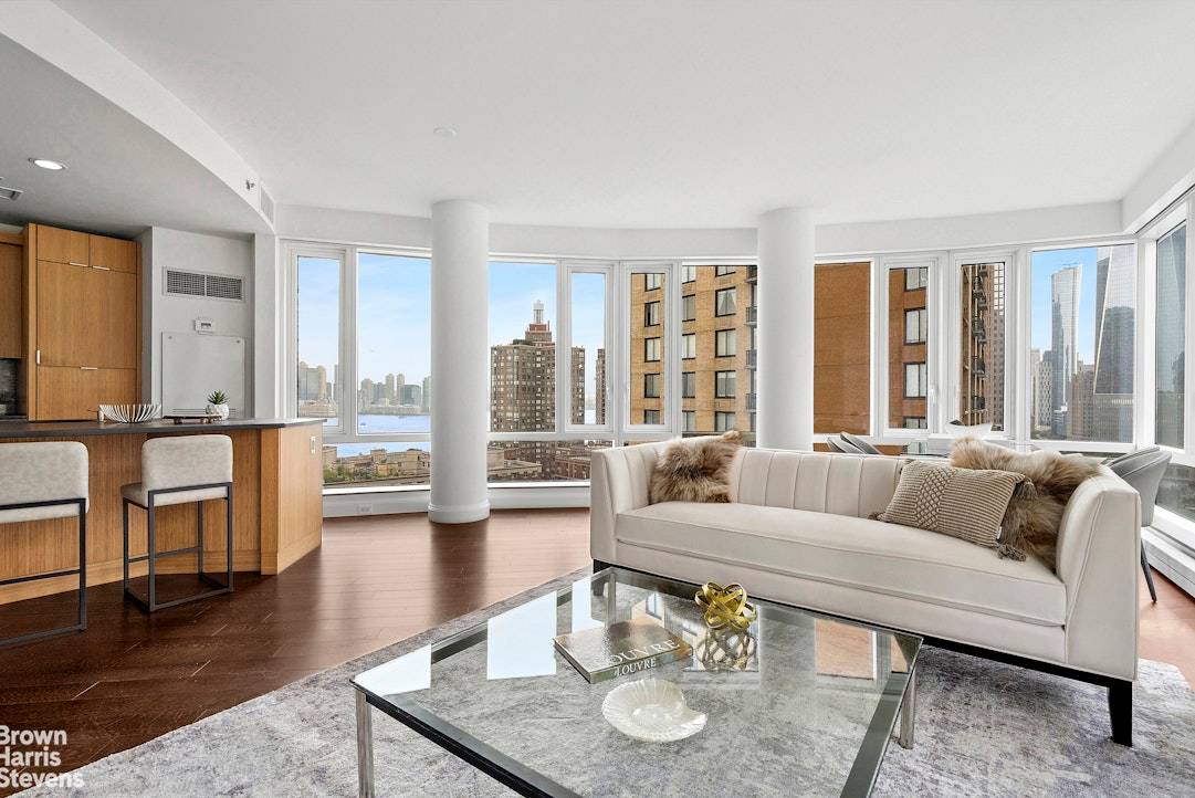 Welcome to this exceptional and unique corner four bedroom, three bathroom residence offering sweeping Hudson River sunsets and direct vistas of the iconic Freedom Tower.