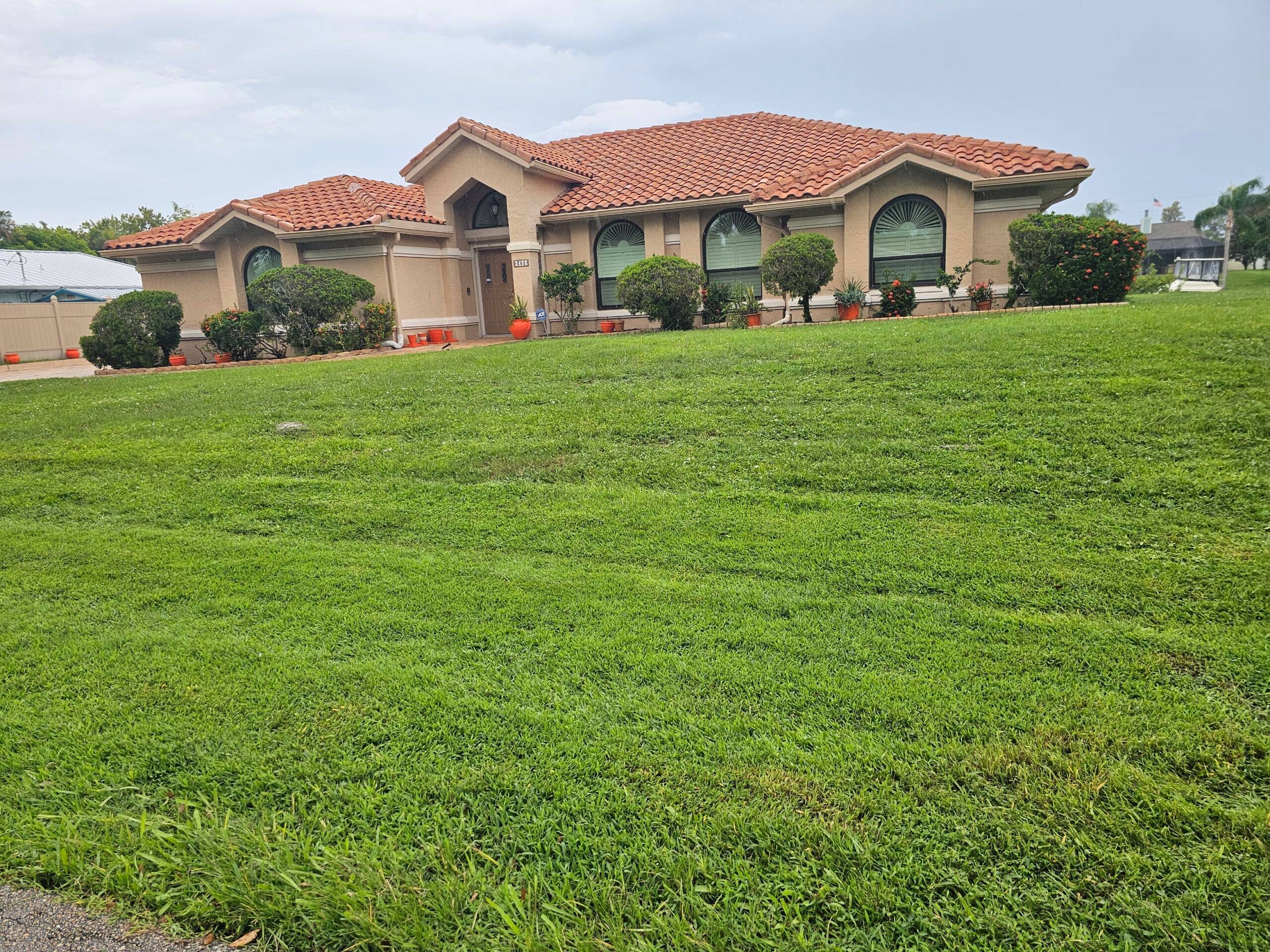 Immaculately maintained 3 Bedroom, 2 1 2 bath pool home on a wide Deep water canal with Ocean Access.
