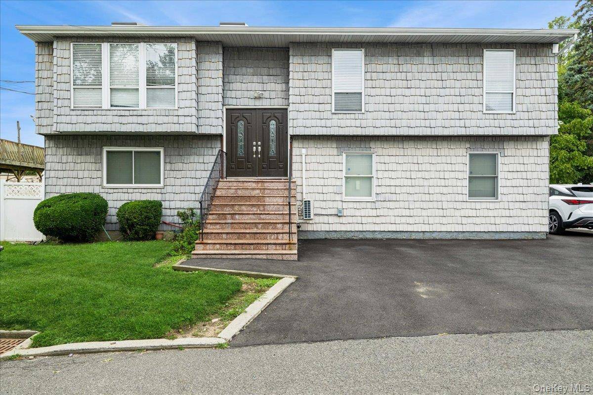 Come Tour This Spacious And Well Maintained Hi Ranch Residence Offering 6 Bedrooms And 4 Full Bathrooms In The Heart Of The Town Of Oyster Bay.