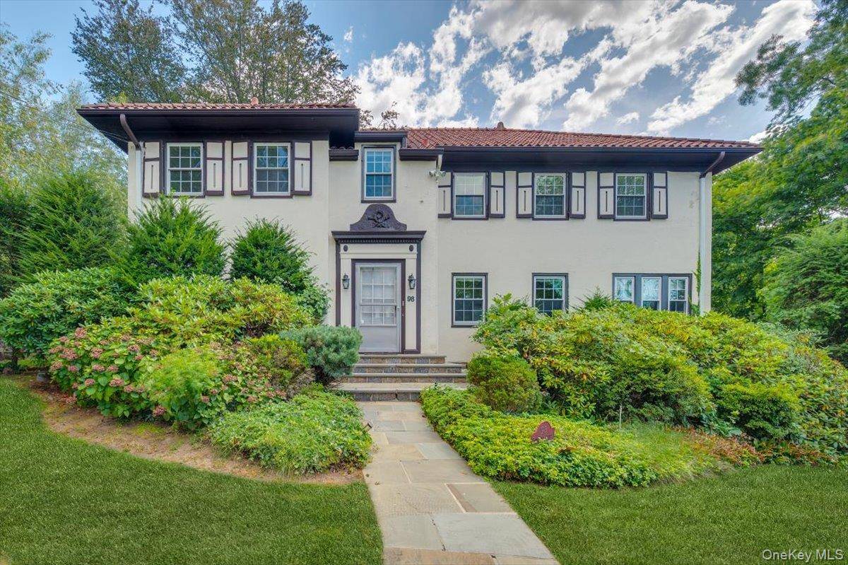 Tucked into the Wykagyl neighborhood, 98 Rose Hill Avenue is a distinctive Center Hall Mediterranean instantly recognizable with its red tile roof and architectural presence.