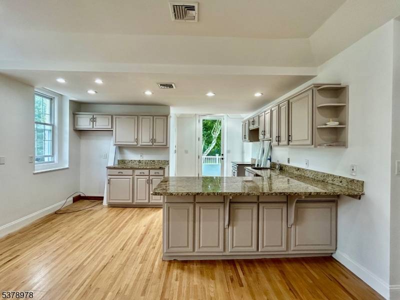 Newly renovated half duplex on a very private 3 acre lot, river front.