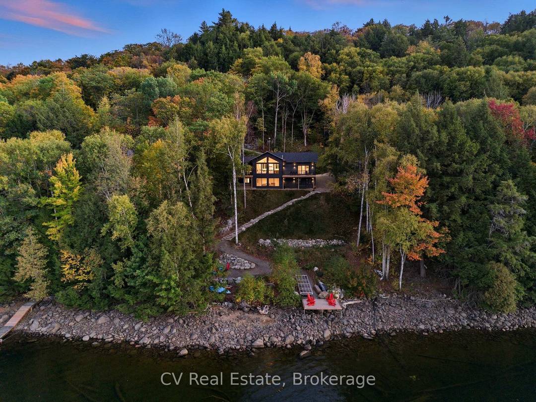 Discover a newly built 2024, turn key cottage with modern design and spectacular lakefront living on Redstone Lake.
