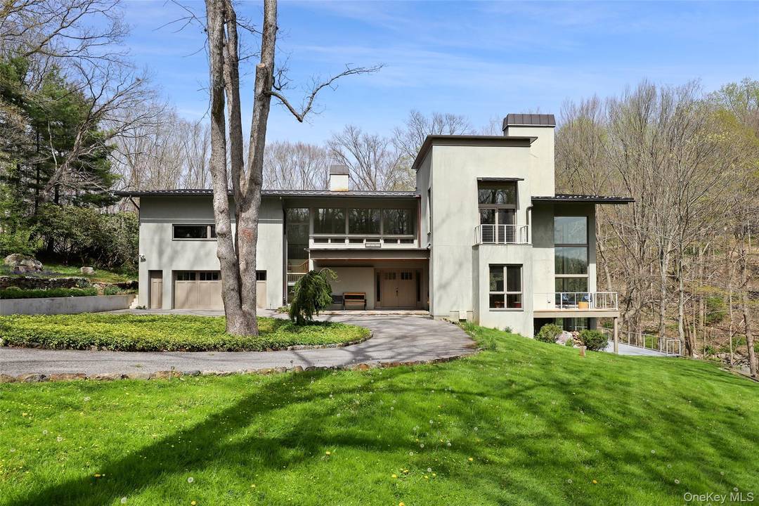 Welcome to your picturesque and dream rental, with breathtaking falling waters overlooking the rushing Mill River and one of the Twin Ponds.