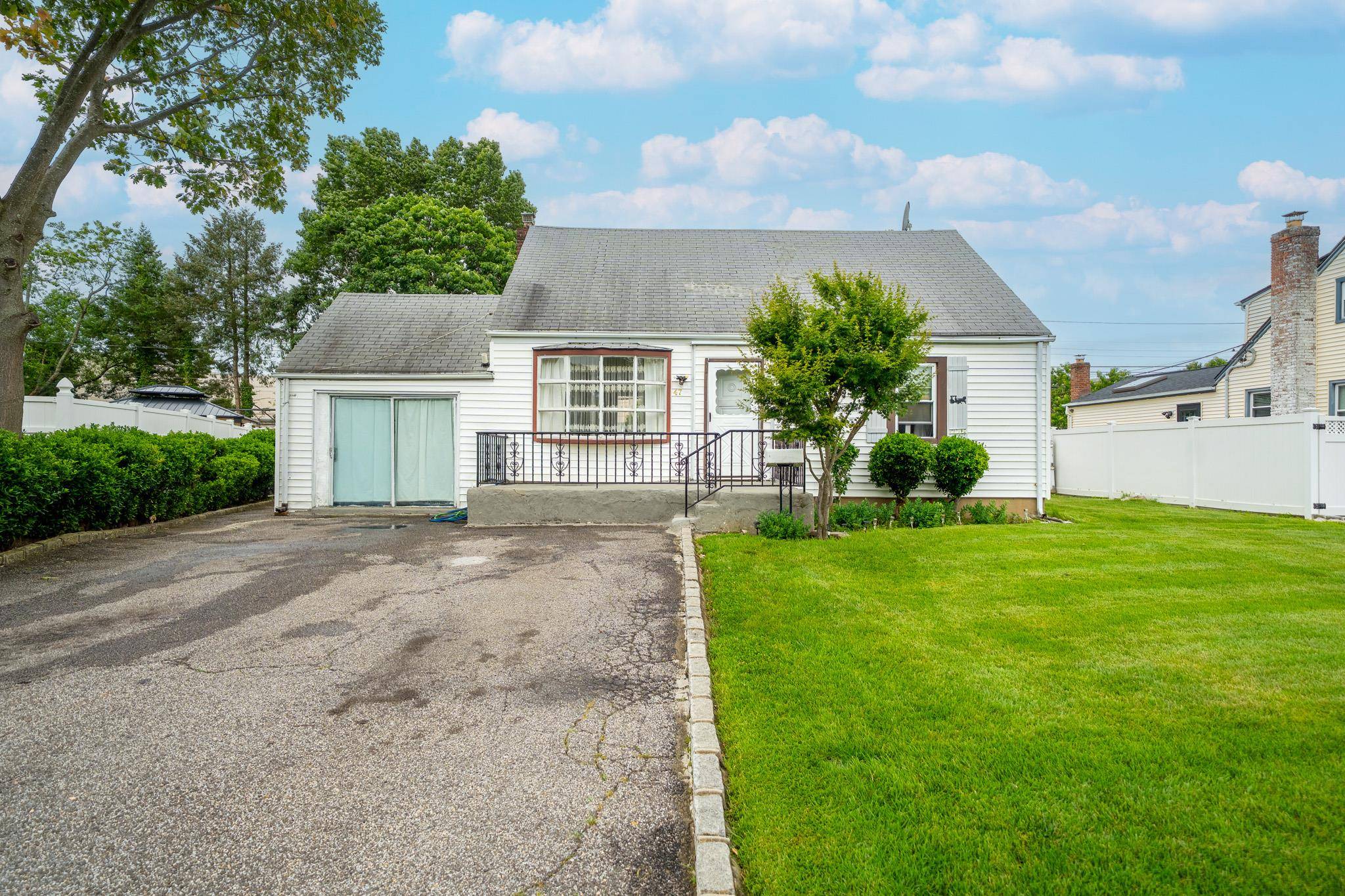 This Home Features Hardwood Flooring, 5Large Rooms, and 3 Full Bathrooms.