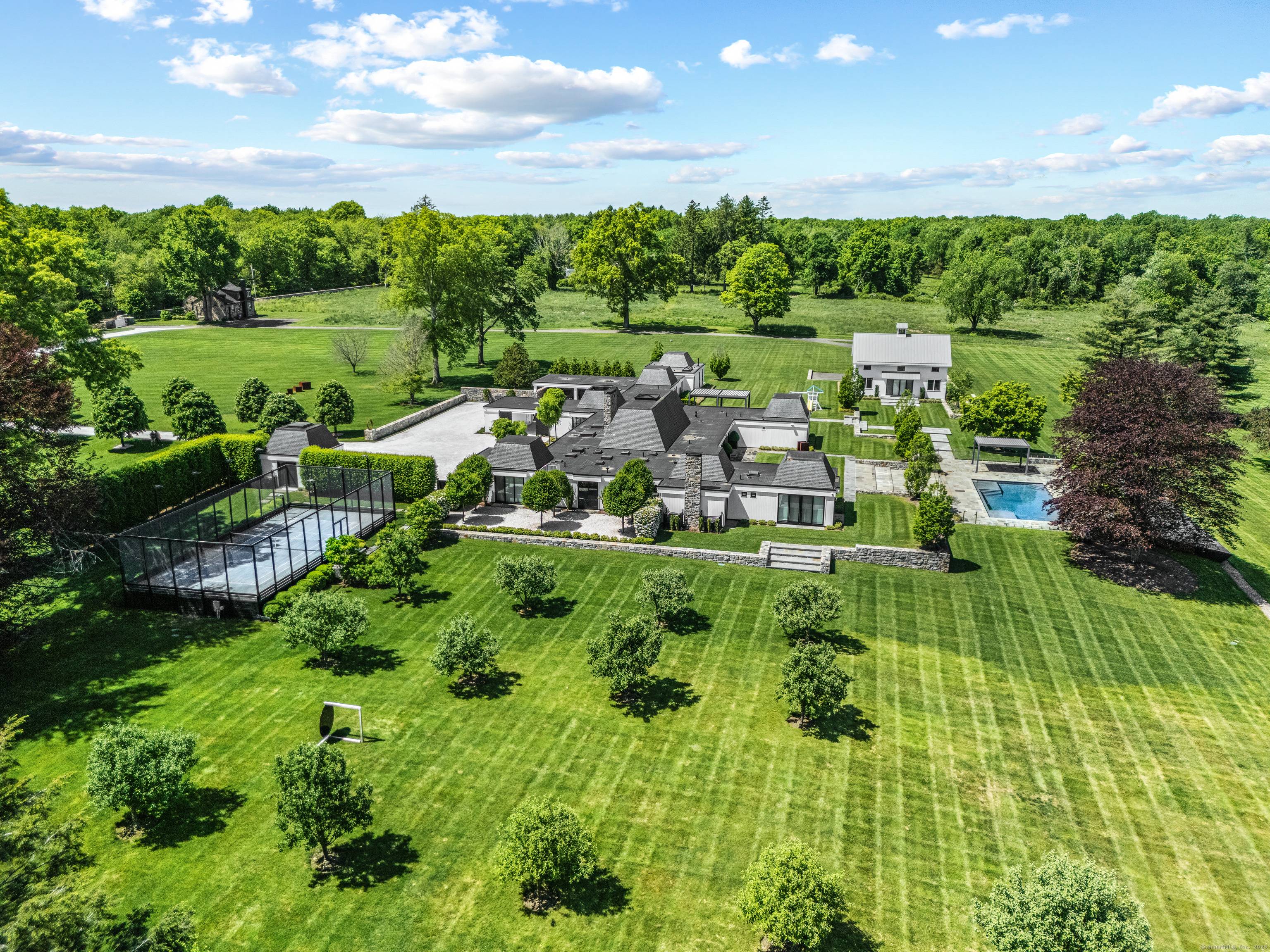Surrounded by stone walls, this storied, spectacular and private 38.