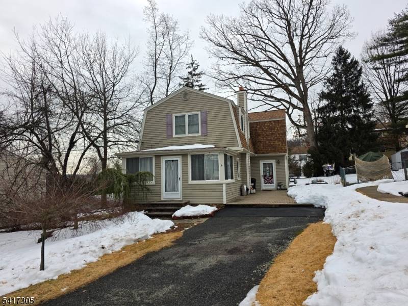 The home features a classic 1930s structure with substantial interior space, 3 bedrooms, 1 1 2 bathroom and a private yard with deck.