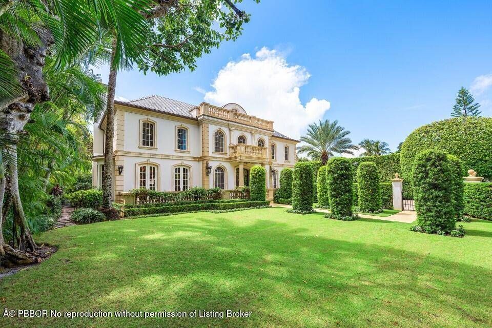 This extraordinary estate at 242 Wells Road combines classic French Provincial architecture with timeless elegance, offering an unparalleled lifestyle on one of Palm Beach's most prestigious streets.