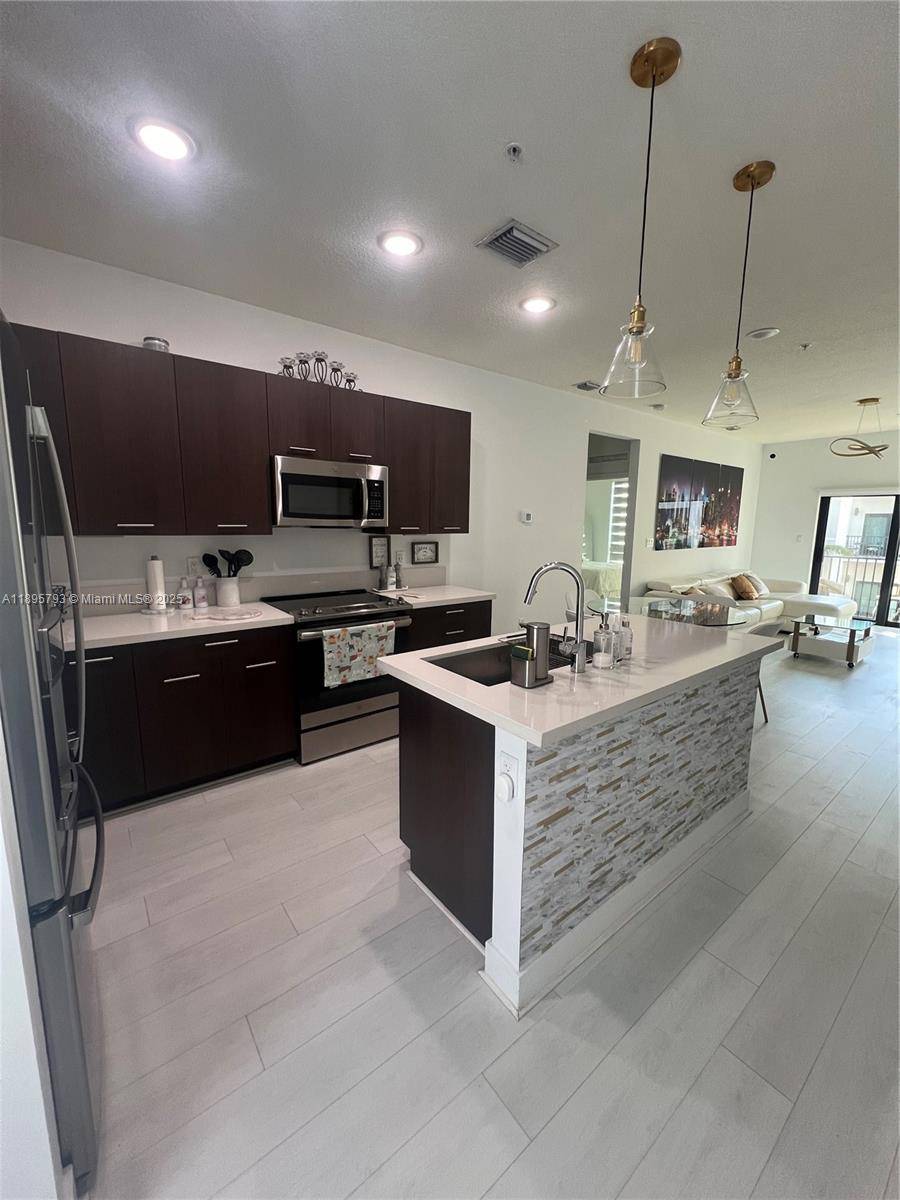 Elegant 3 bed, 2 bath condo in the heart of Doral, offering luxurious, resort style living in a family friendly community just steps from Downtown Doral.
