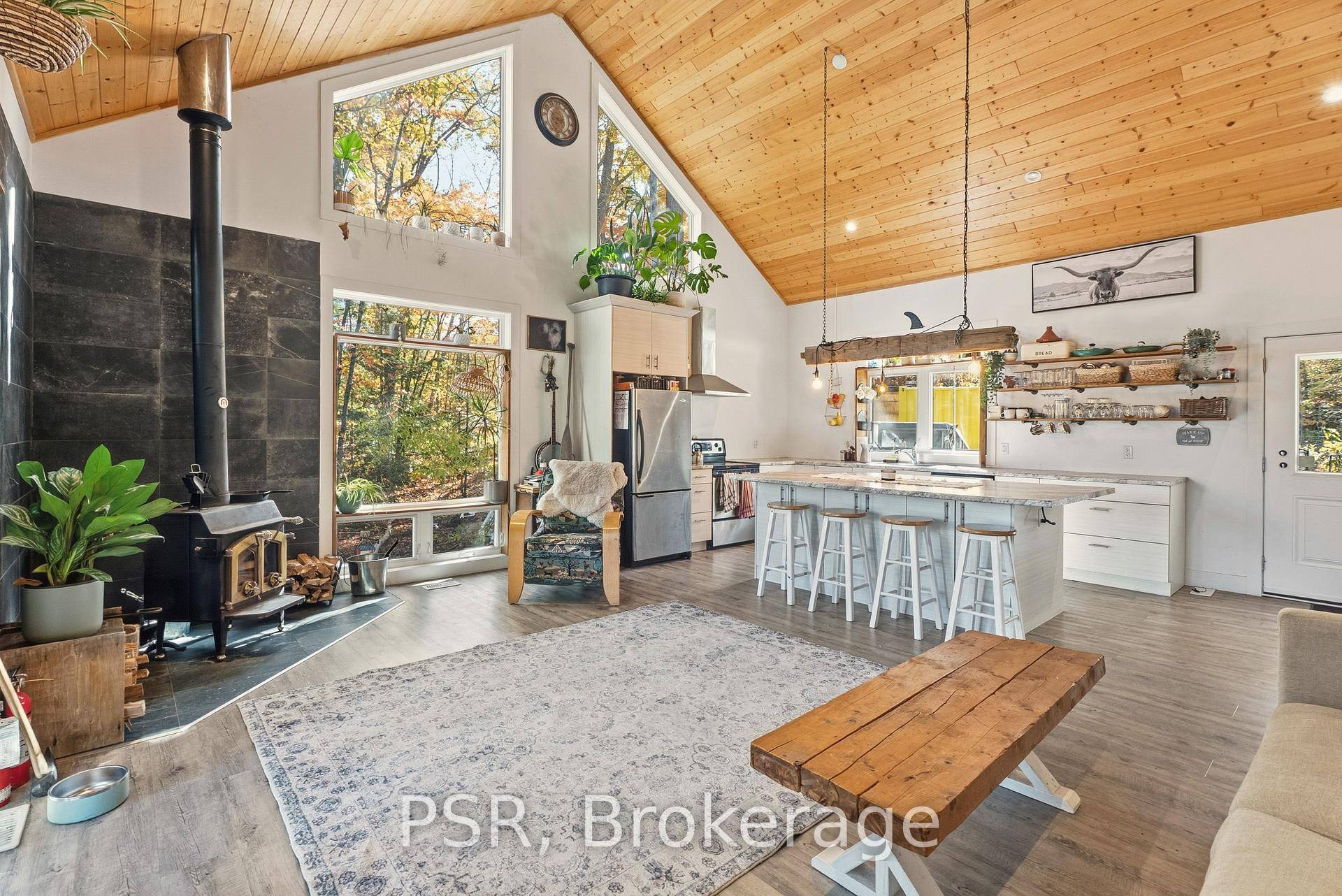 Welcome to your modern Muskoka escape on the Moon River, a stunning newly built, four season Bungaloft that perfectly fuses contemporary design with the natural charm of cottage country.
