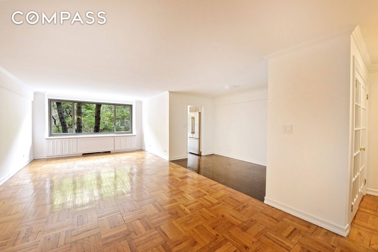 Welcome to this charming residence on East 64th Street, where timeless elegance offers a canvas ready for your personal touch.