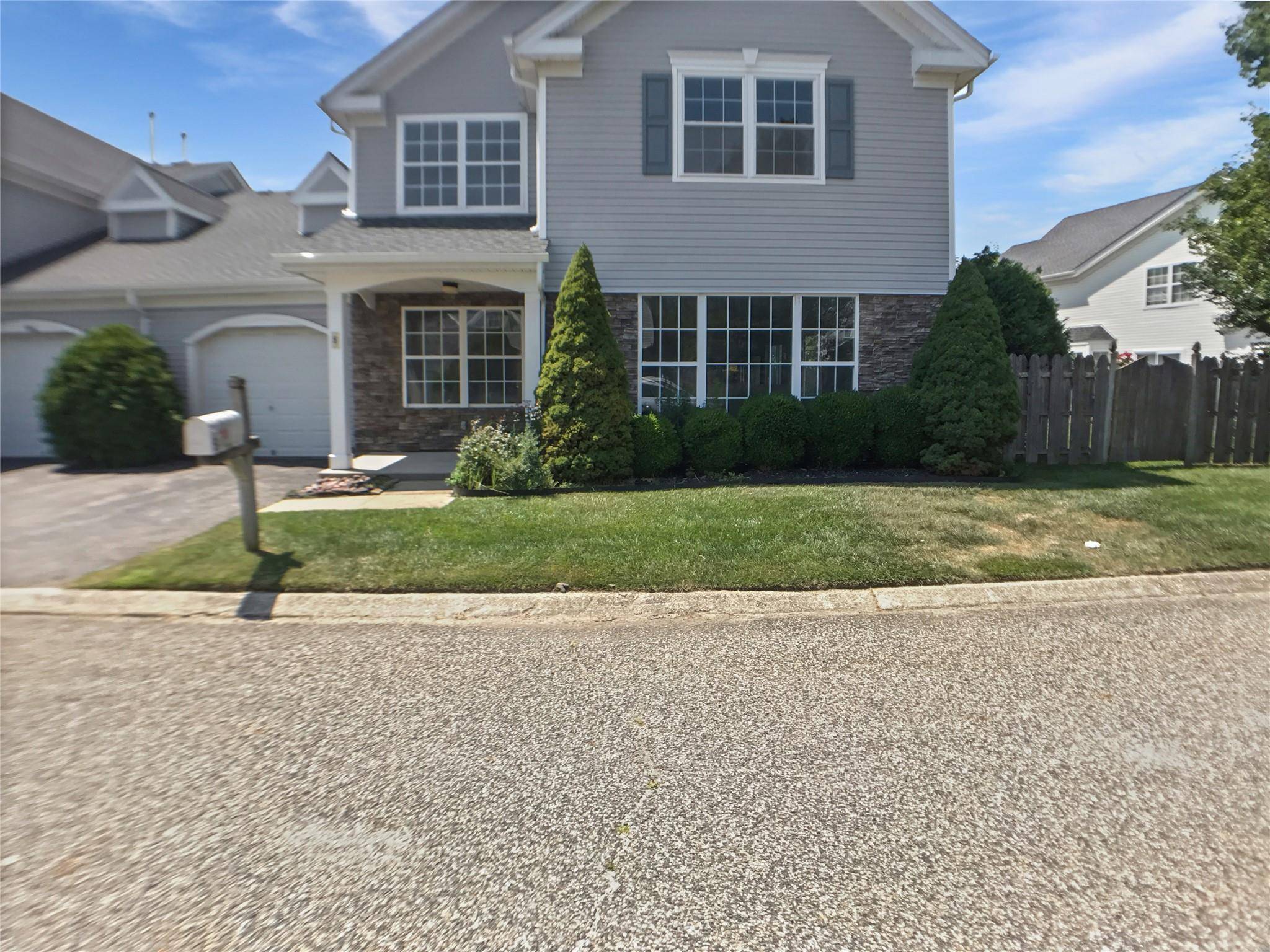Welcome to 5 Lori Ln, a beautifully maintained townhome nestled in the sought after 24 hour gated community of Birchwood at Spring Lake.