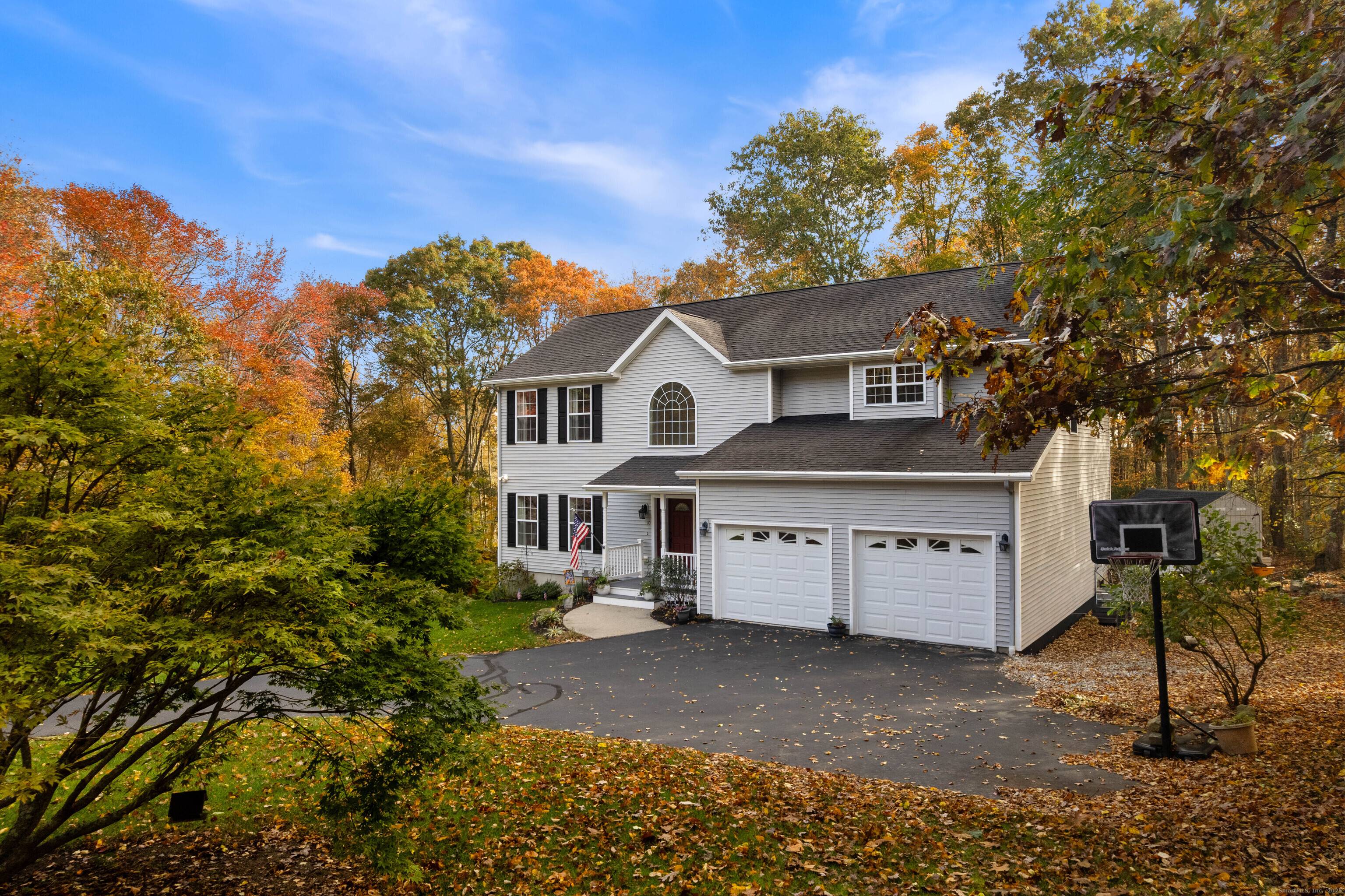 Welcome to this beautifully maintained colonial set on a private, wooded lot surrounded by the colors of every New England season.