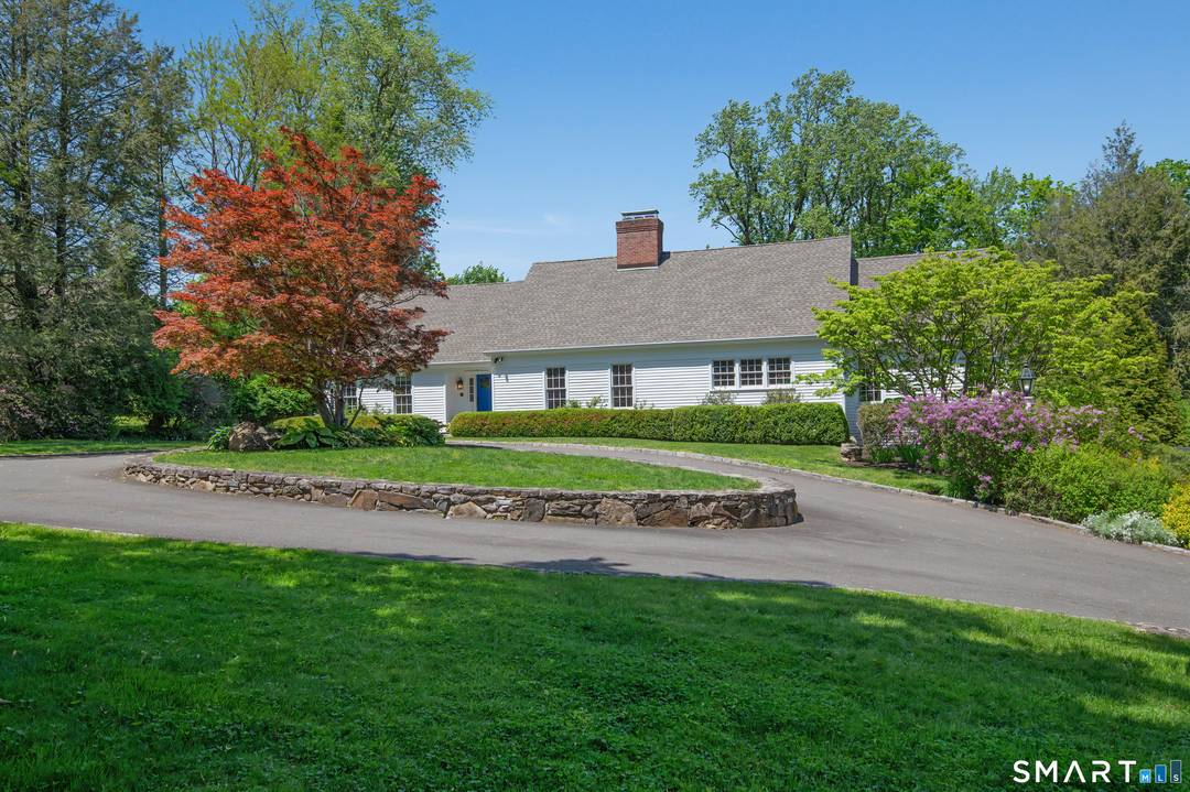 Sophisticated in town living meets timeless New England architecture in this exceptional Cape Cod residence, beautifully sited on a gorgeous park like acre just moments from Ridgefield's iconic Main Street.
