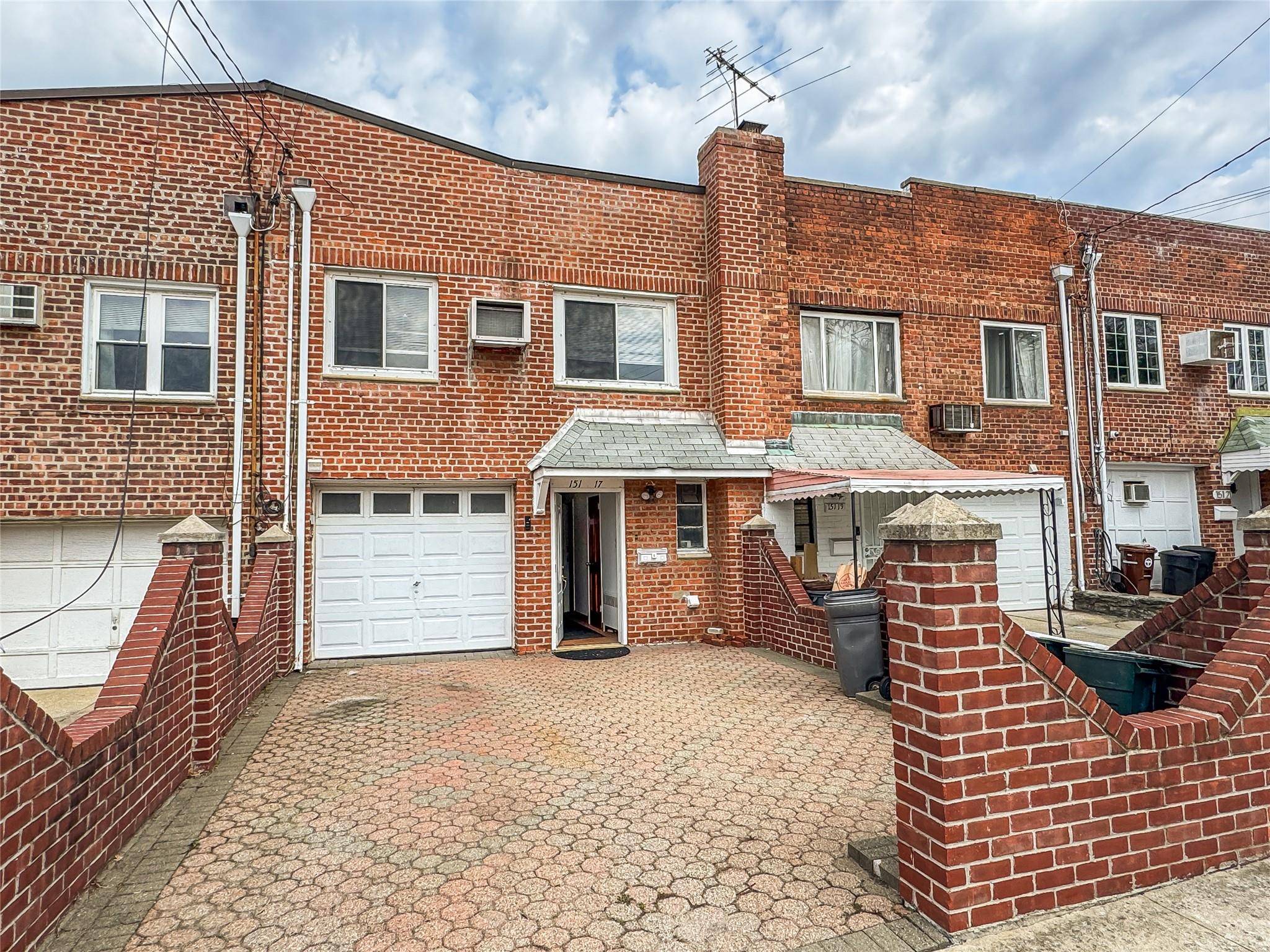 Two family brick house with water view and bridge view.