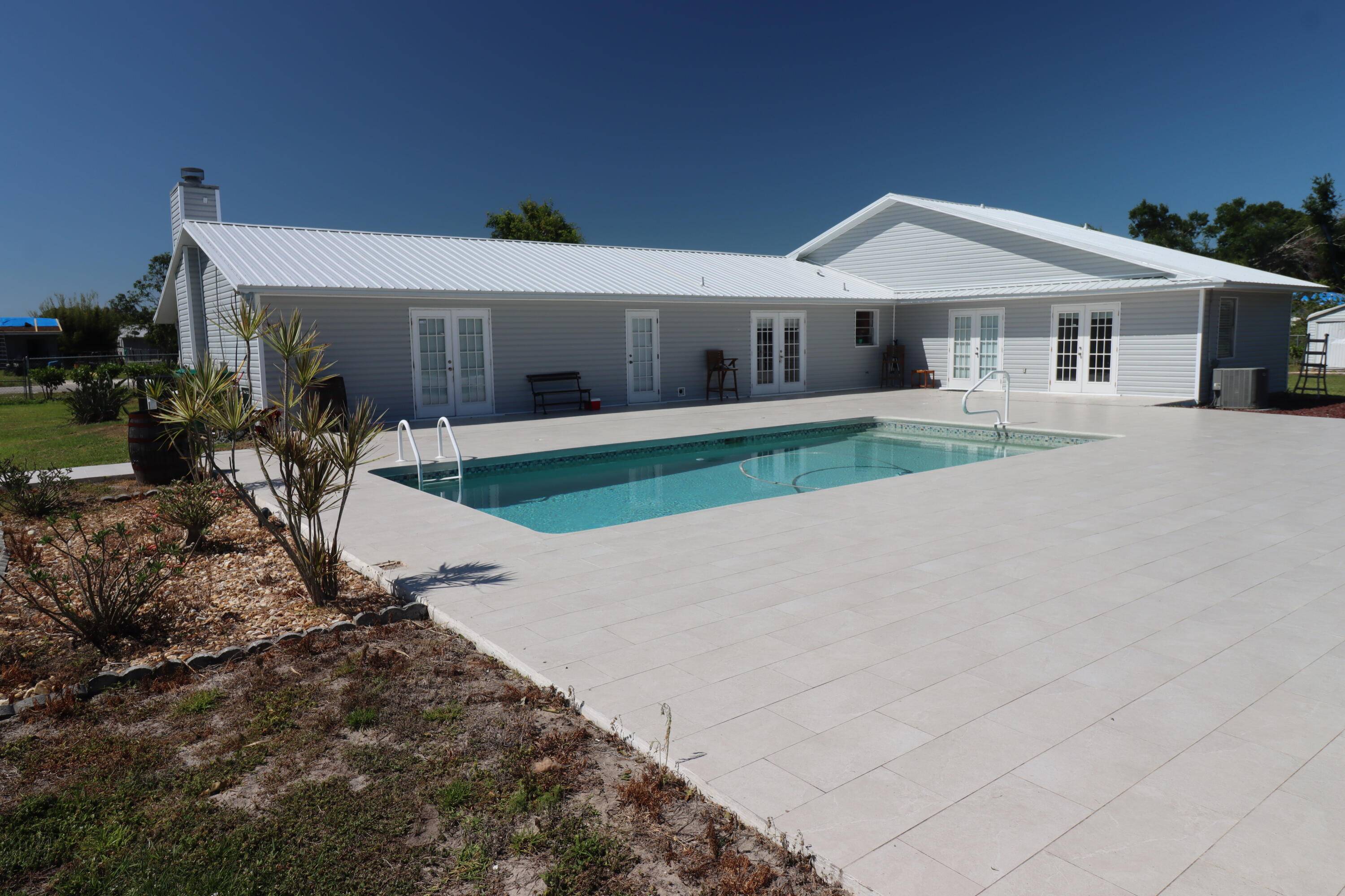 3 Bed 2 Bath, single family pool home on 1 acre.