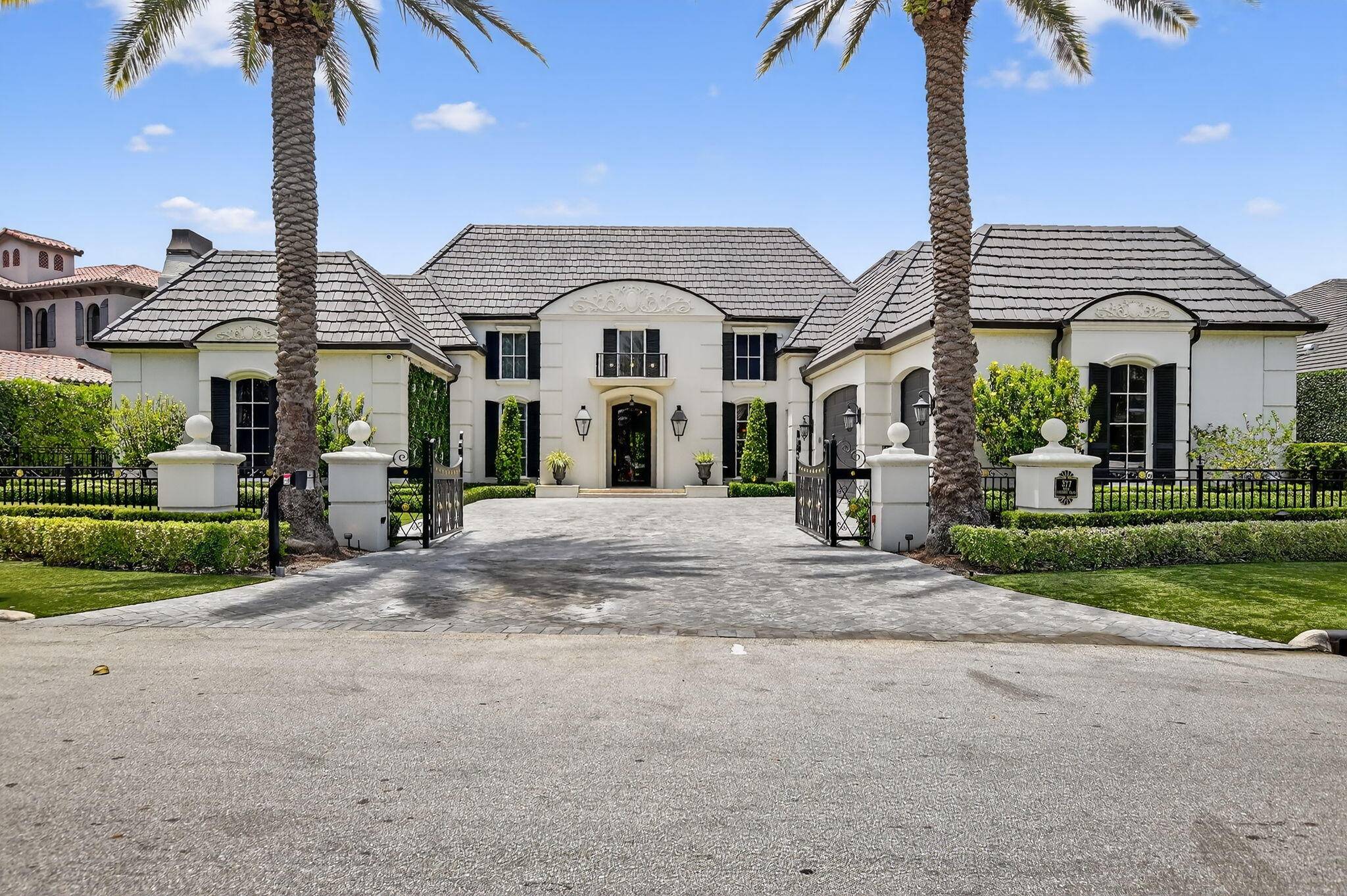 An Elegant French chateau style residence in the prestigious Royal Palm Yacht Country Club.