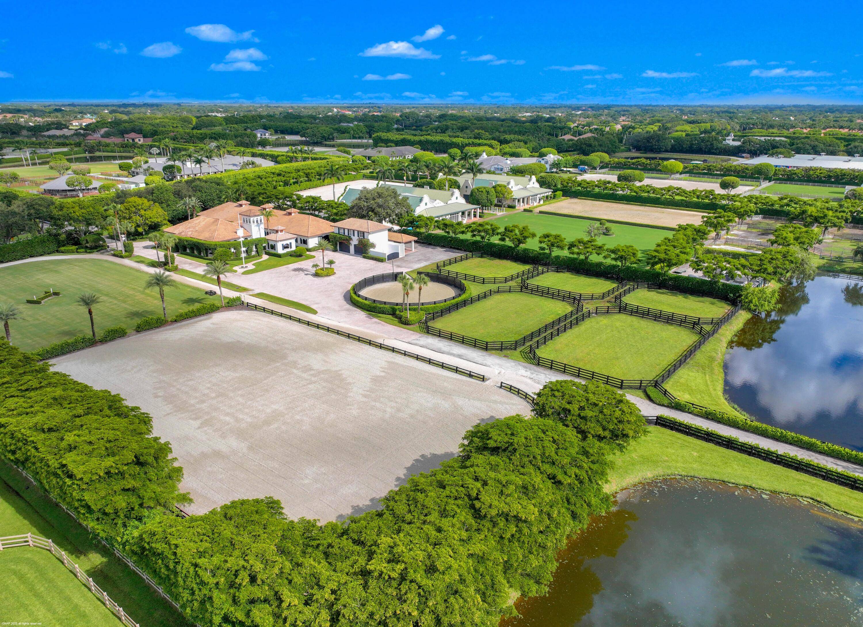 Nestled in prestigious Grand Prix Village, this exceptional 5.