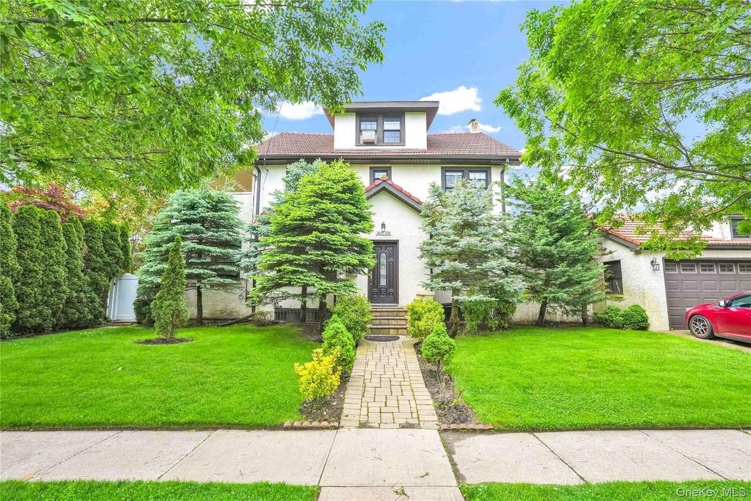 Welcome to 160 08 12th Road, a rarely available legal two family home located on a prime 48x100 corner lot in the desirable neighborhood of Beechhurst.