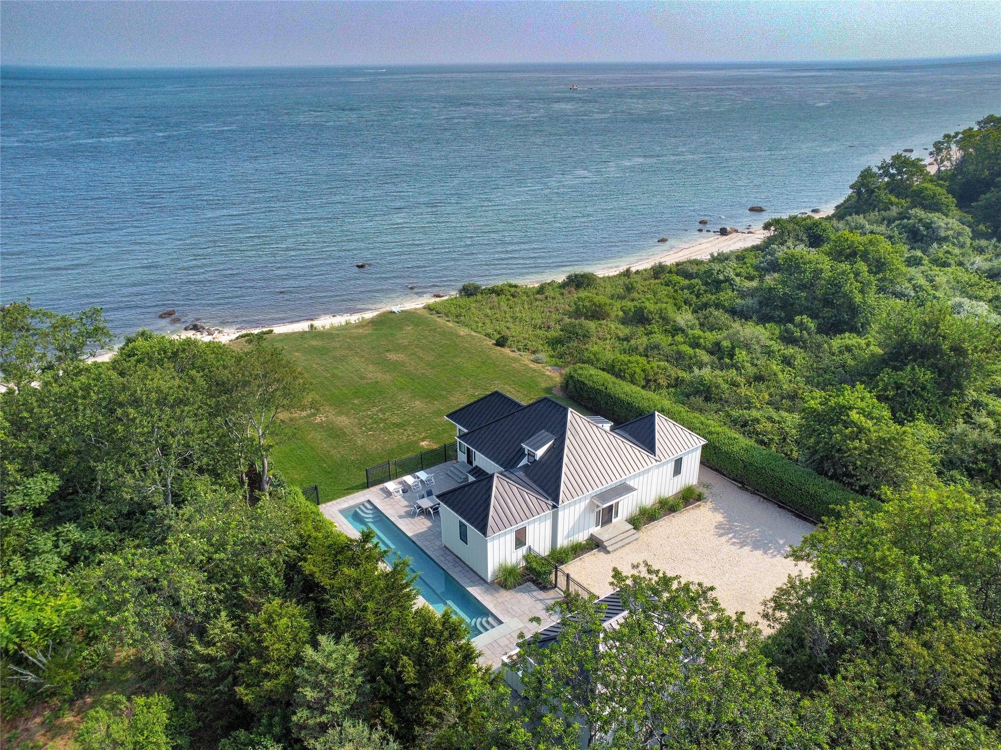 At the end of a secluded, private one mile road, where the land meets the Long Island Sound, this newly renovated modern beach house offers breathtaking views, refined design, and ...