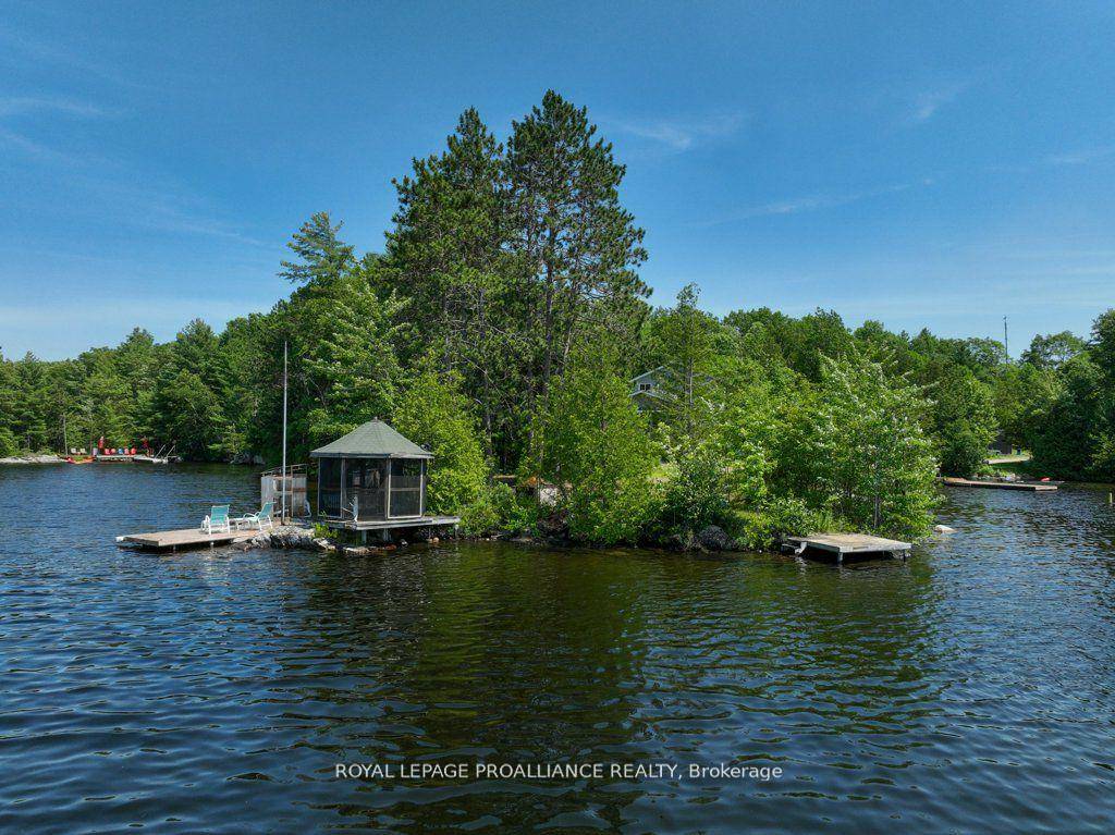 Nestled on 1. 9 acres of land with an impressive 393 ft of waterfront access, this property features a private beach, docks for your watercraft, and deep swimming areas.