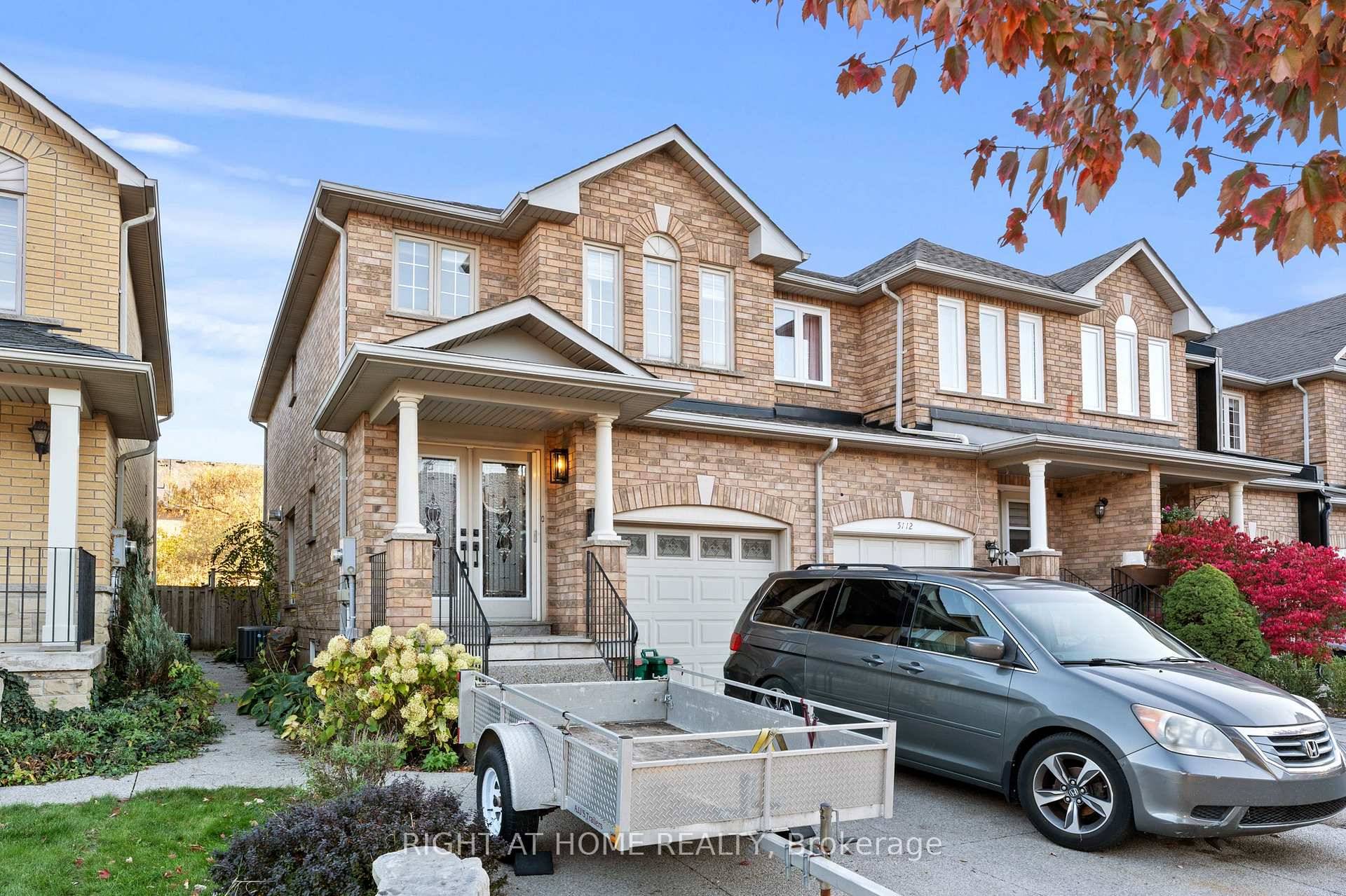 Welcome to this exceptional end unit townhouse featuring premium finishes throughout !