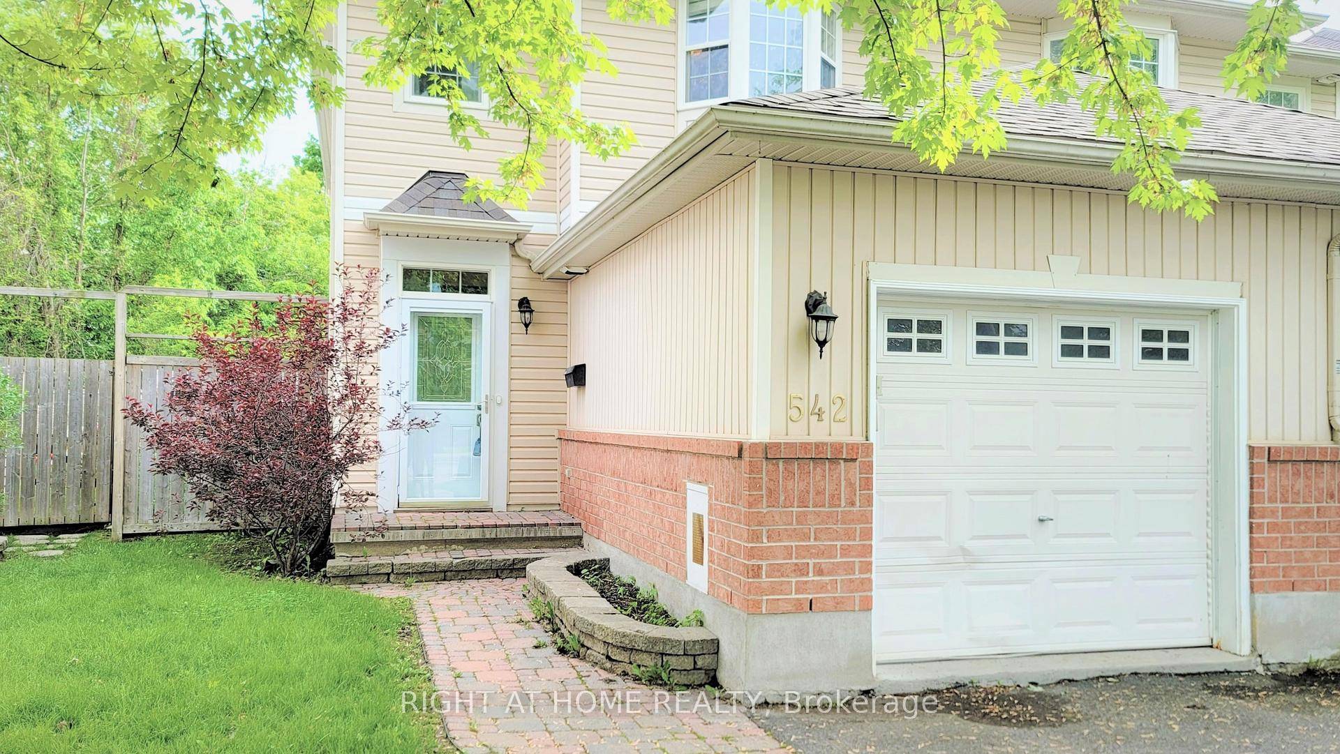 End unit townhouse with no rear neighbours, and irregular larger lot size with private backyard.