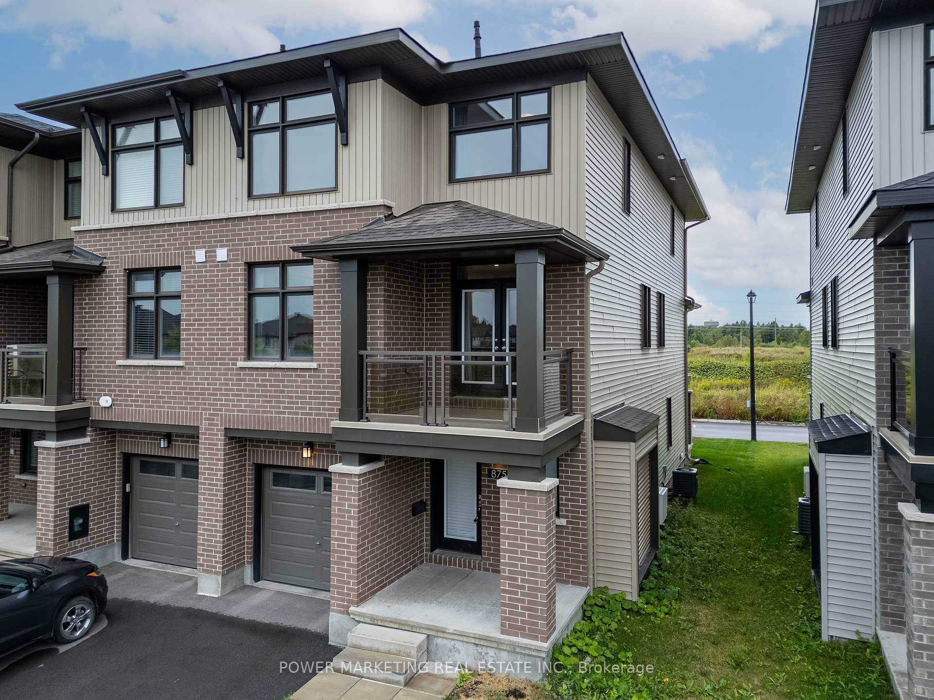 Welcome to 875 Couloir Rd, an executive 2 bedroom den, 4 bathroom end unit townhome in the desirable Trailsedge community.