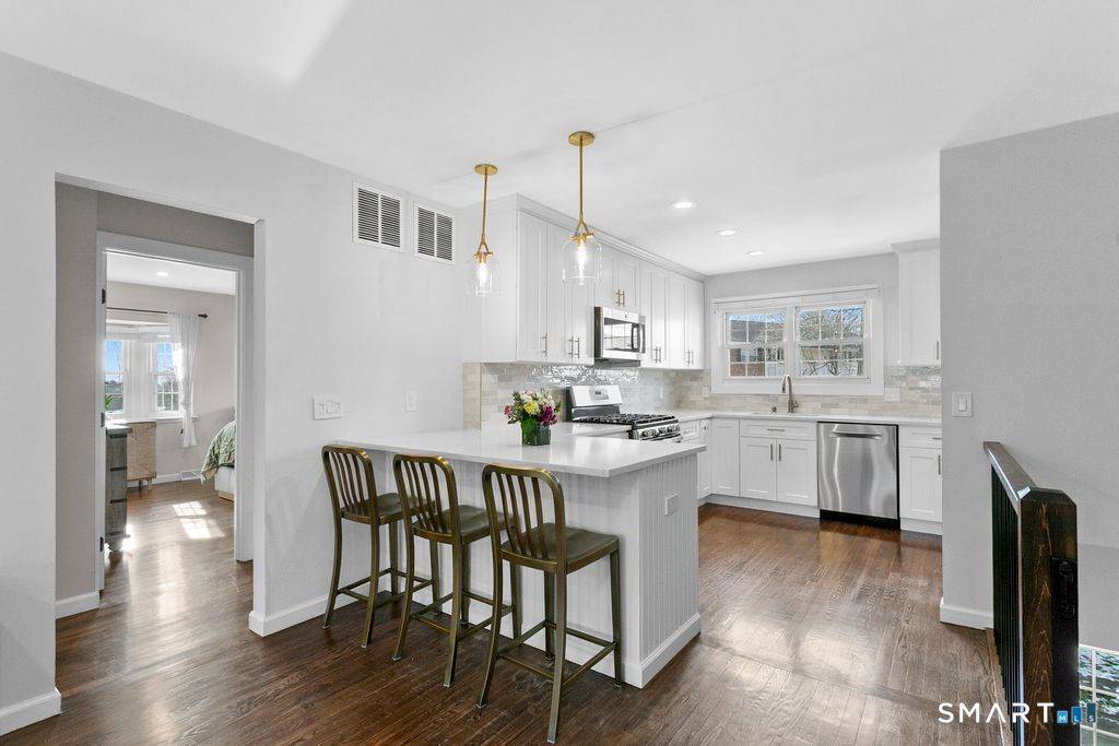 COMPLETELY REMODELED, gorgeous and stylish second floor Mosswood condominium.