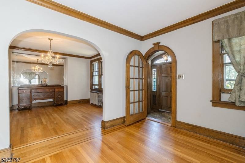 Timeless charm through out this beautiful Colonial style home includes chestnut moldings, unique arched doorways hardwood flooring.