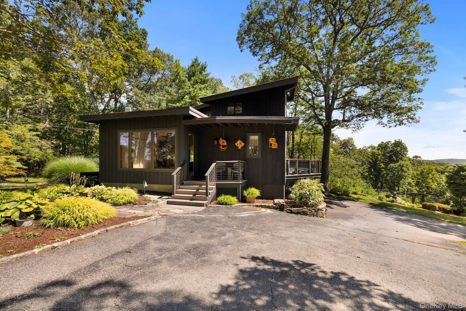 Wake up each day to panoramic 180 degree views of the rolling Westchester countryside, from this Midcentury Modern home designed by a student of Frank Lloyd Wright.