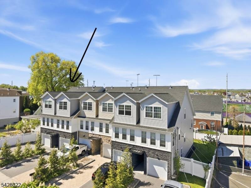 Newer construction townhouse in Bergen County with low HOA and private outdoor space on TWO levels.