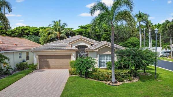 Welcome to this beautifully maintained 2 bedroom, 2 bathroom home with a den, located in the active 55 community of Grove Isle.