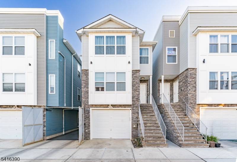 NEWLY BUILT, UNIQUE two family featuring a rare ground level unit with 2 rooms and a full bath, home office, or added flexibility.