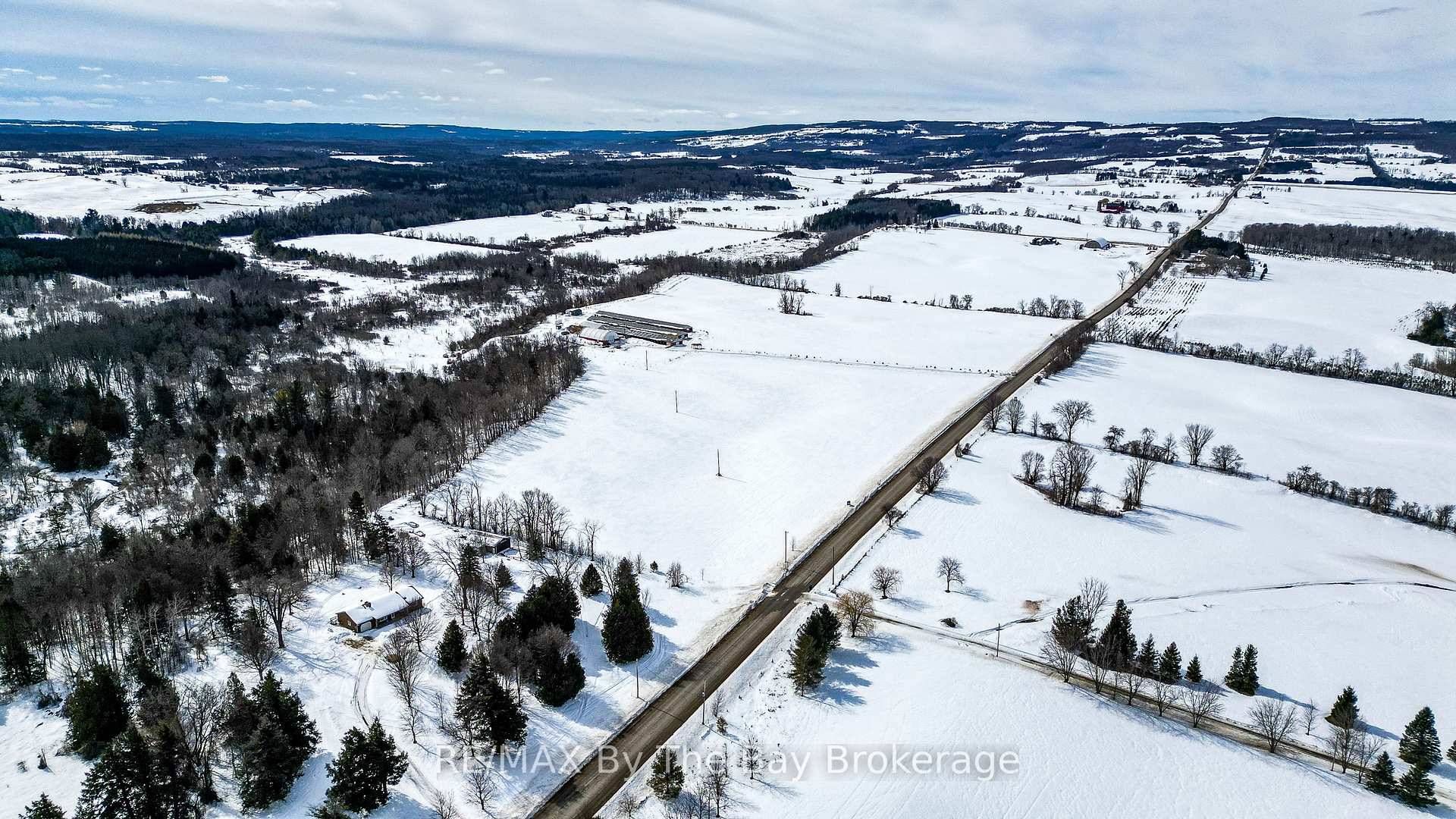 Discover a unique opportunity to blend country living with income potential on this versatile 33 acre property, minutes from Creemore's thriving agricultural community.