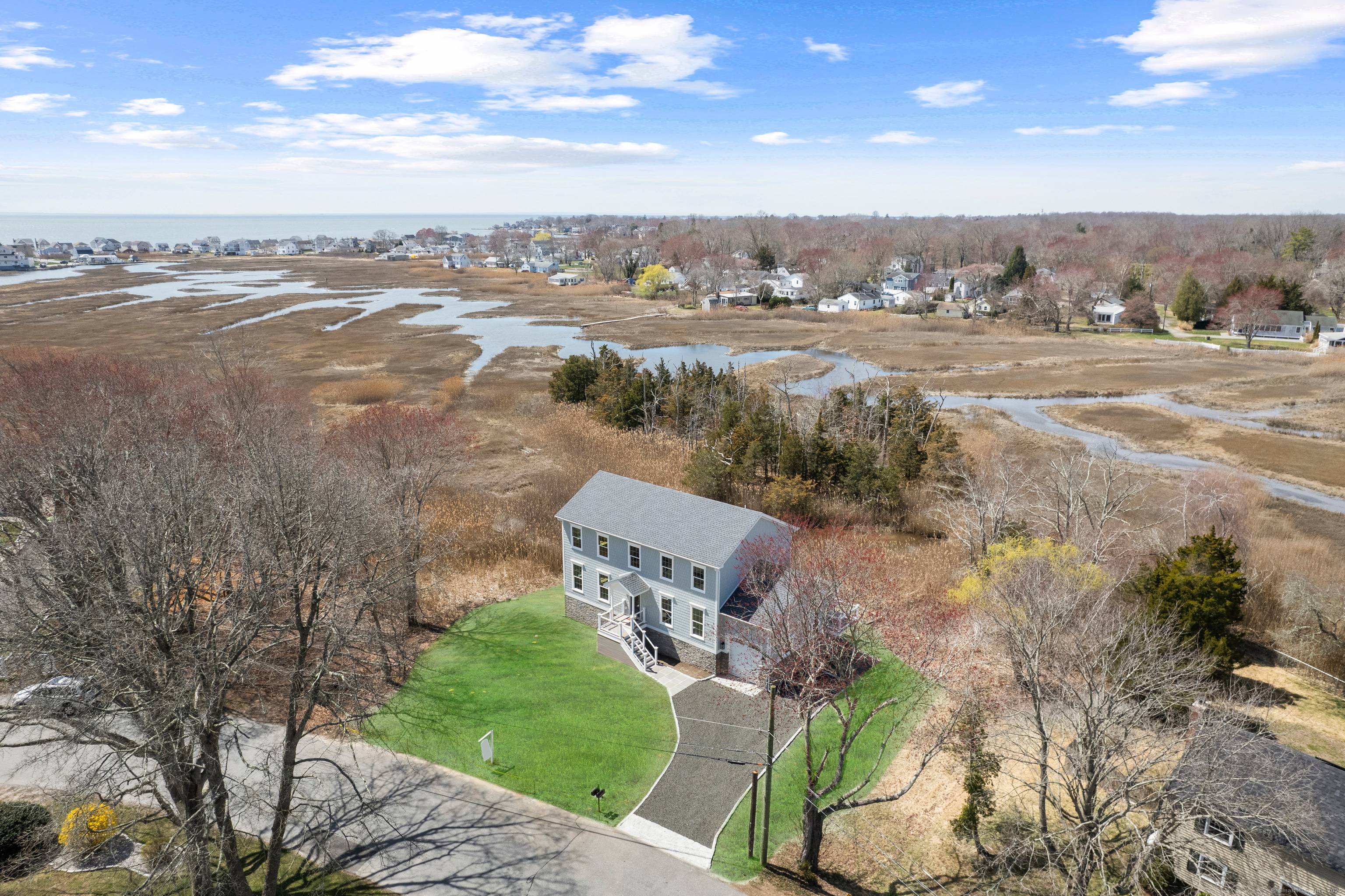 No Flood Insurance with this rare opportunity to own a newly built luxury residence with unobstructed water views, high end finishes, and an exceptional location.