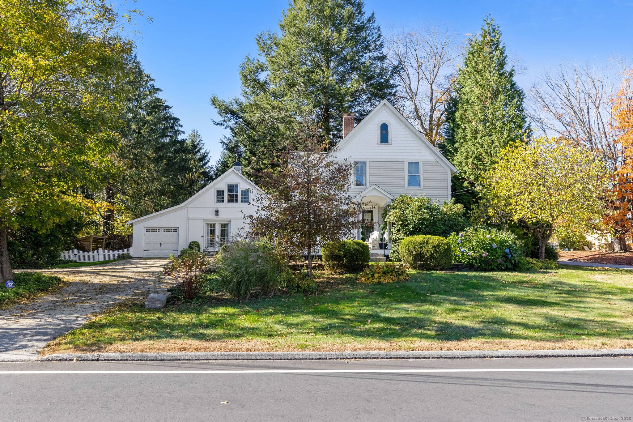 Tucked away on a picturesque Colonial Main Street, this beautifully renovated 19th century home blends historic charm with modern comfort and artistry.