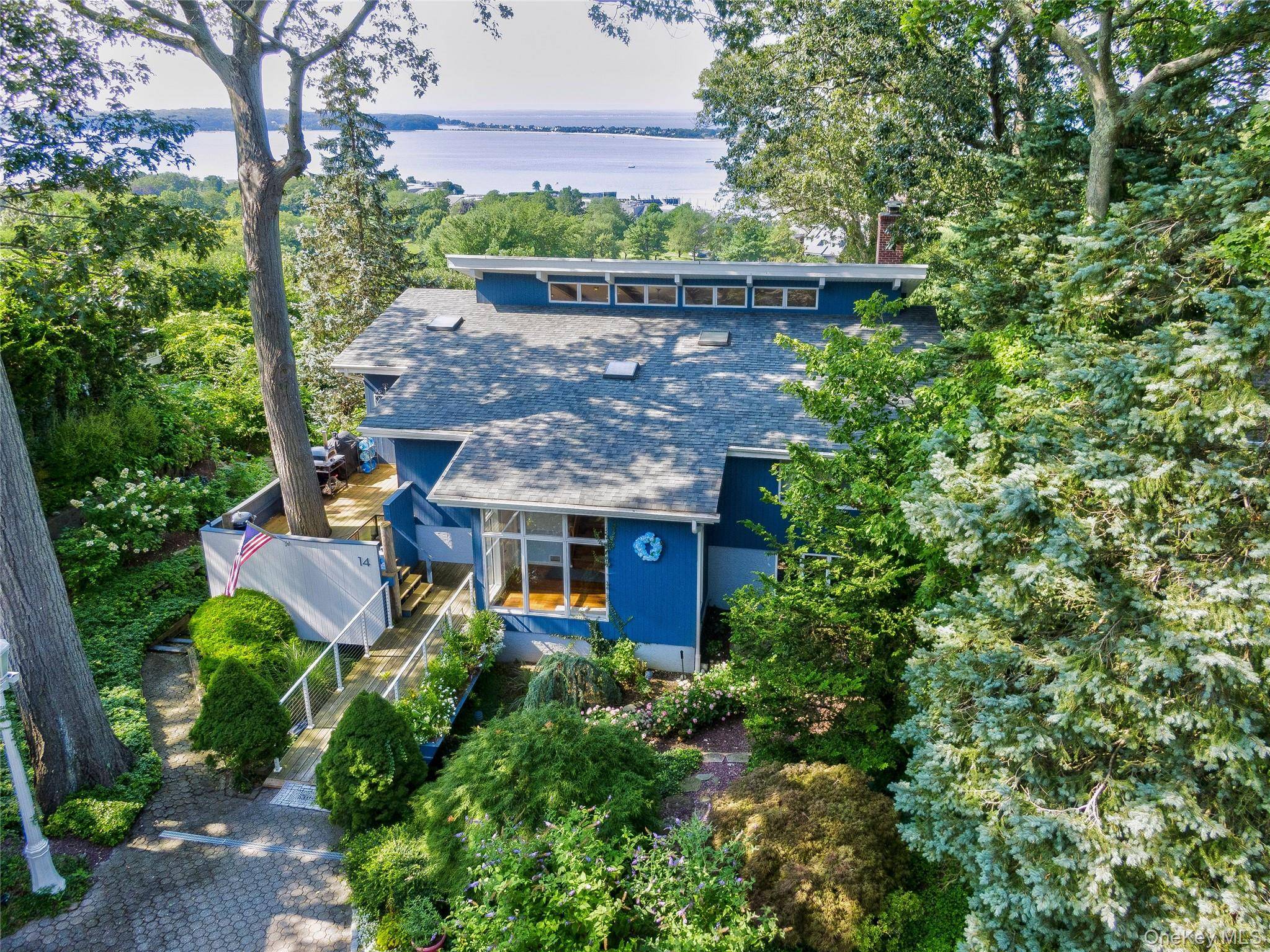 Perched high above the Long Island Sound, this stunning four bedroom, two and a half bath contemporary home offers panoramic water views that will take your breath away.