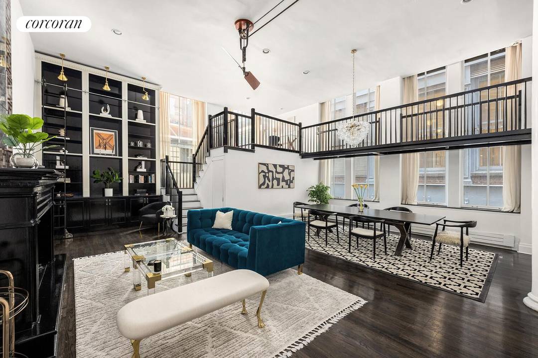 Nestled in the heart of Tribeca, this exceptional triplex loft seamlessly combines historic architectural charm with a sophisticated modern design.